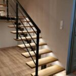 Custom black steel staircase and handrail for a modern residential interior in Scotland.