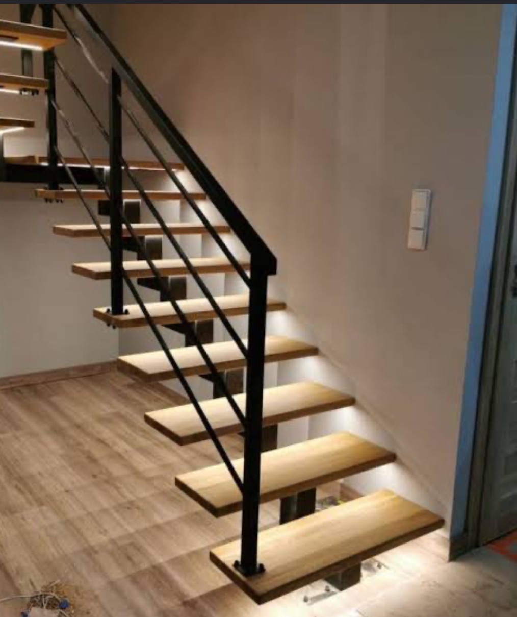 Custom black steel staircase and handrail for a modern residential interior in Scotland.
