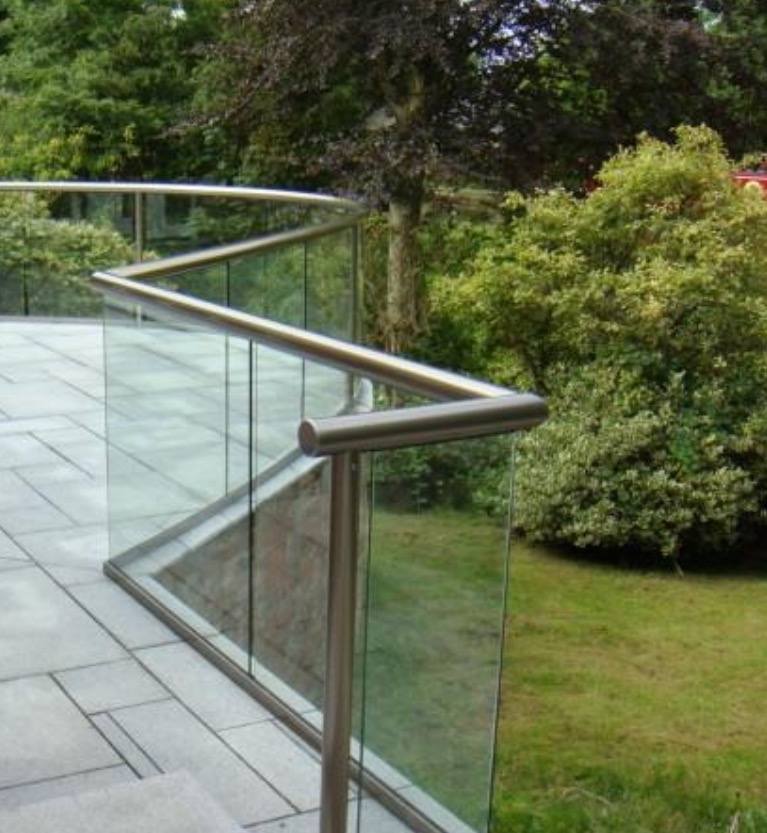Curved stainless steel and glass balustrade corner for a residential property in Scotland.