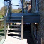 Custom stainless steel and glass staircase balustrade for a residential property in Scotland.