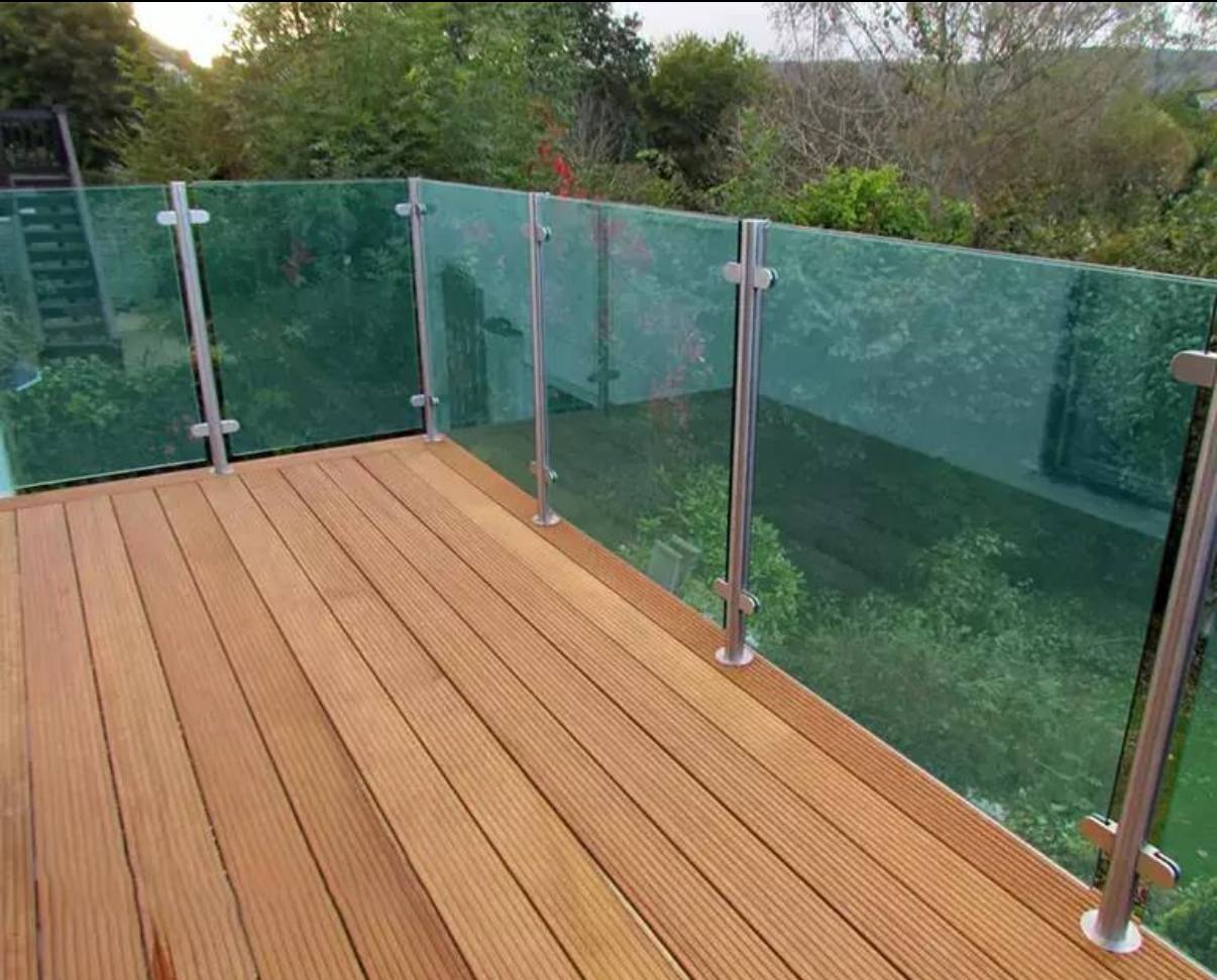 Custom stainless steel and glass balustrade installed on a residential decking in Scotland.