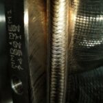 Close-up of a precision TIG weld on an industrial stainless steel component in Scotland.