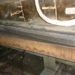 Multi-pass Flux-Cored (FCAW) weld on heavy steel pipe for industrial fabrication.