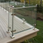 Frameless glass balustrade with stainless steel posts installed on a residential decking in Scotland.