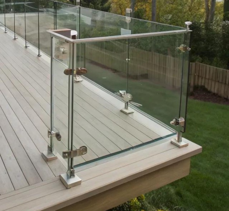 Frameless glass balustrade with stainless steel posts installed on a residential decking in Scotland.